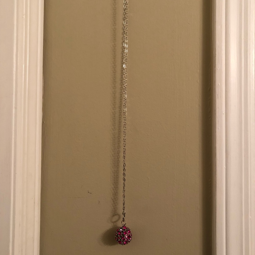 long adjustable silver necklace with pink circle