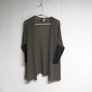 Army green cardigan with leather sleeves.