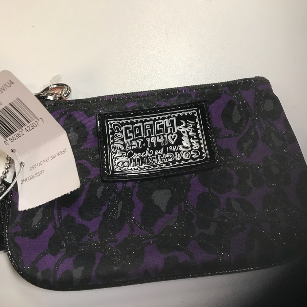 Used once Purple/Black Wristlet