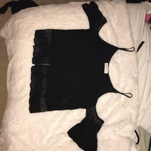 black shoulderless top