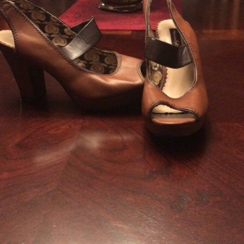 Never worn, but have lightly discolored heel.
