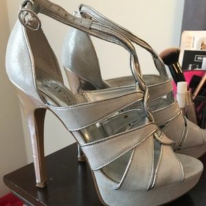 Silver Guess heels, worn a few times. Size 7.5