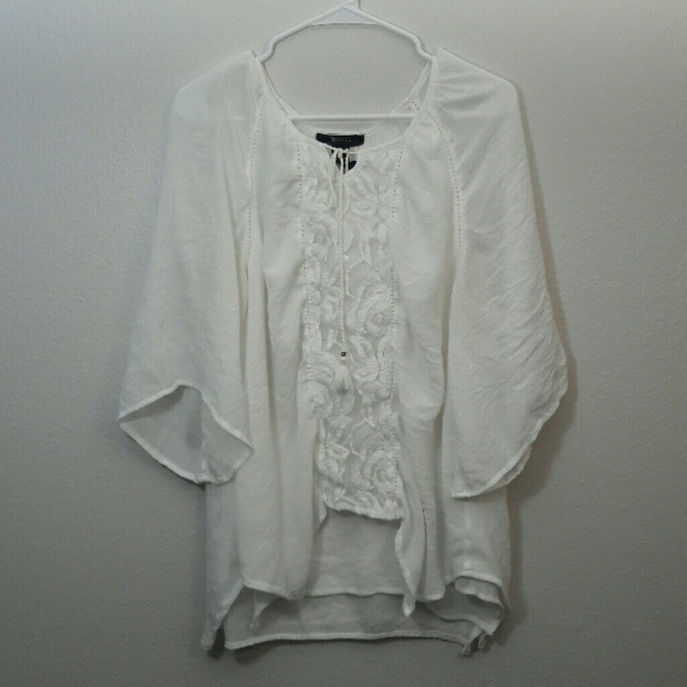 Flow White knit top.