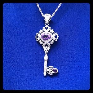 Silver necklace with purple stone pendant