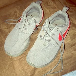 Grey and red Nike sneaker