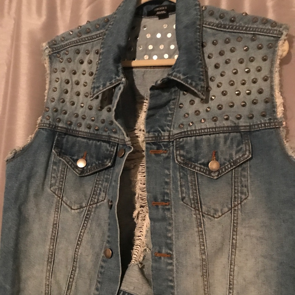 Studded and distressed denim vest