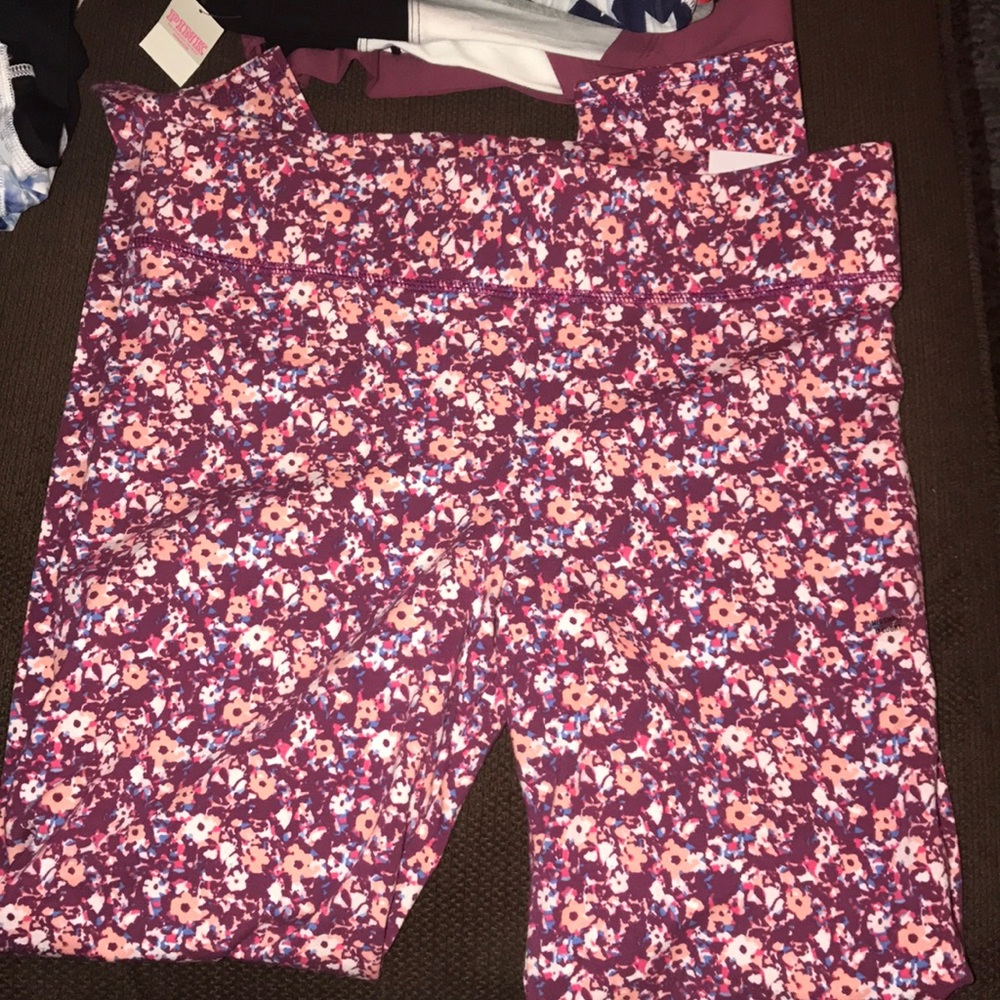 Two pairs of multicolored leggings
