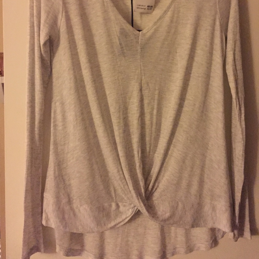Brand new long sleeved top. Runs big.