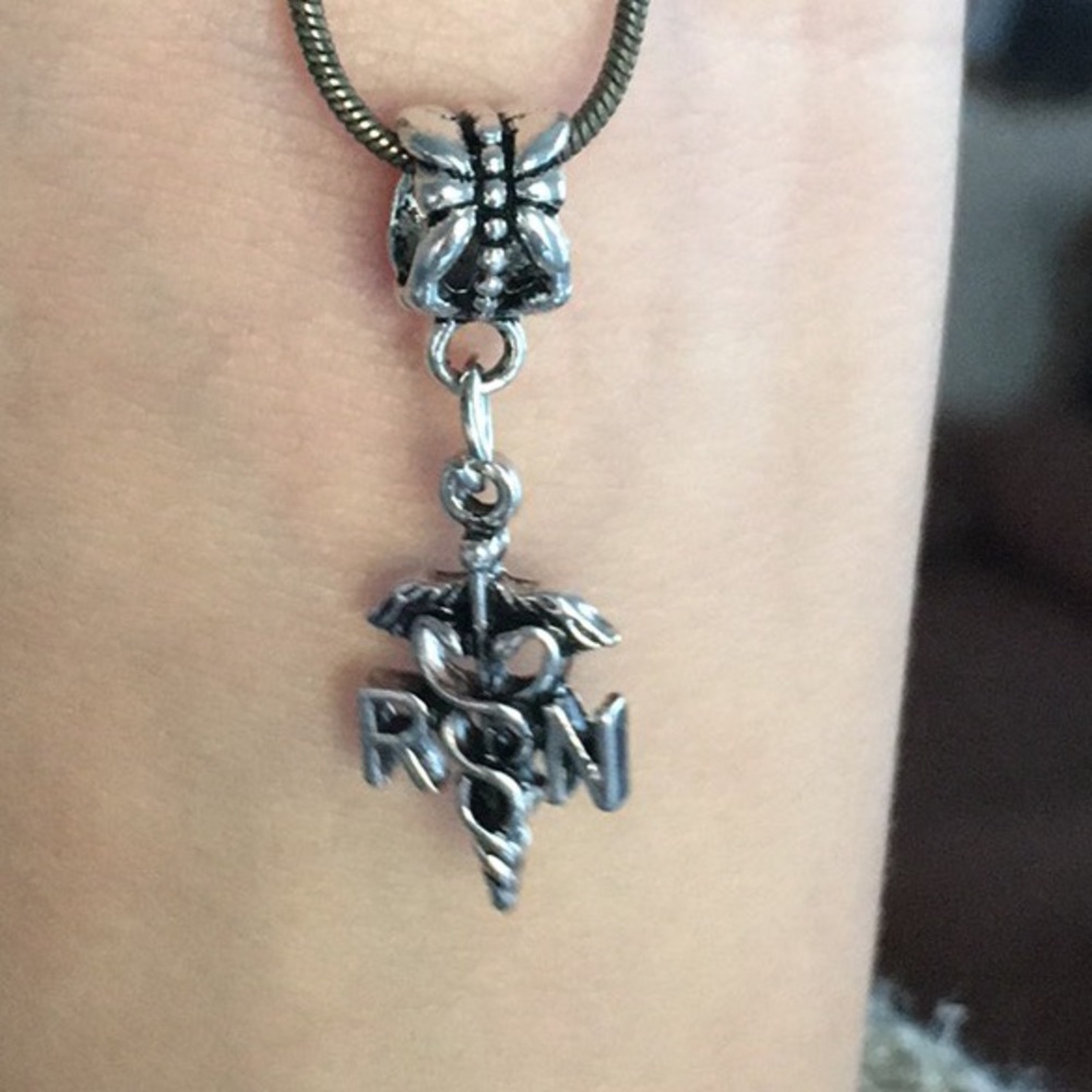 Brand new RN Dangle Charm