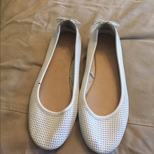 White flats, lace-up detail on back