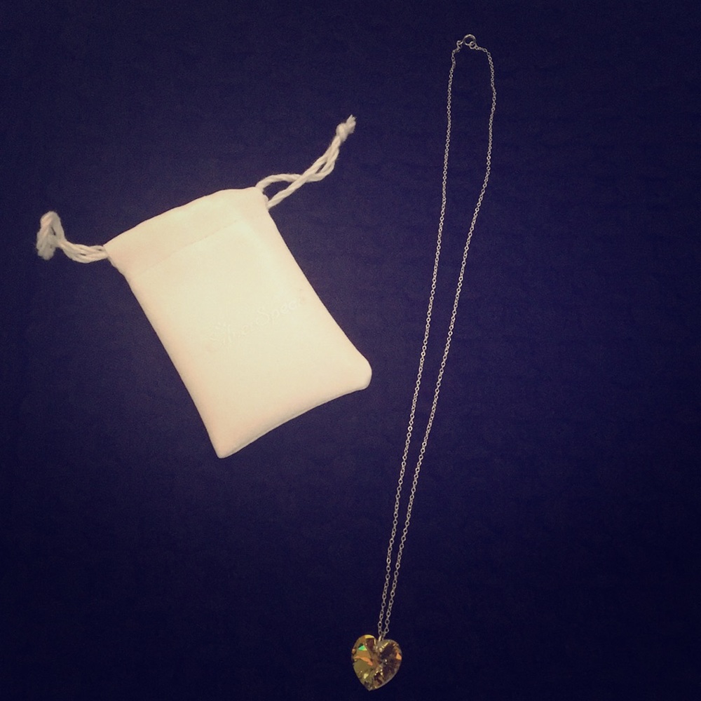 Crystal heart shaped necklace with silver chain.