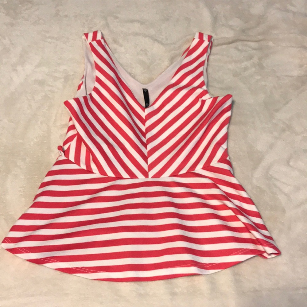 Dressy tank top. V neck. Flares at bottom