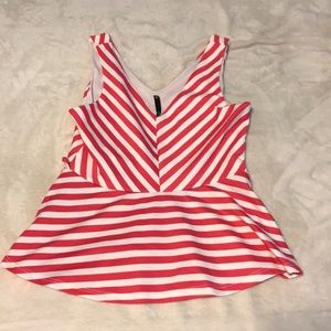 Dressy tank top. V neck. Flares at bottom