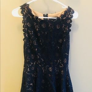 Nude covered in navy lace dress