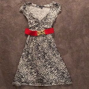Black and white stretch dress with red belt