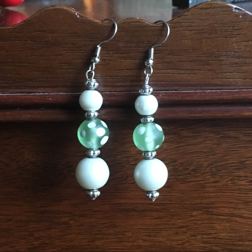 3/$10 Large green and white polka dot earrings