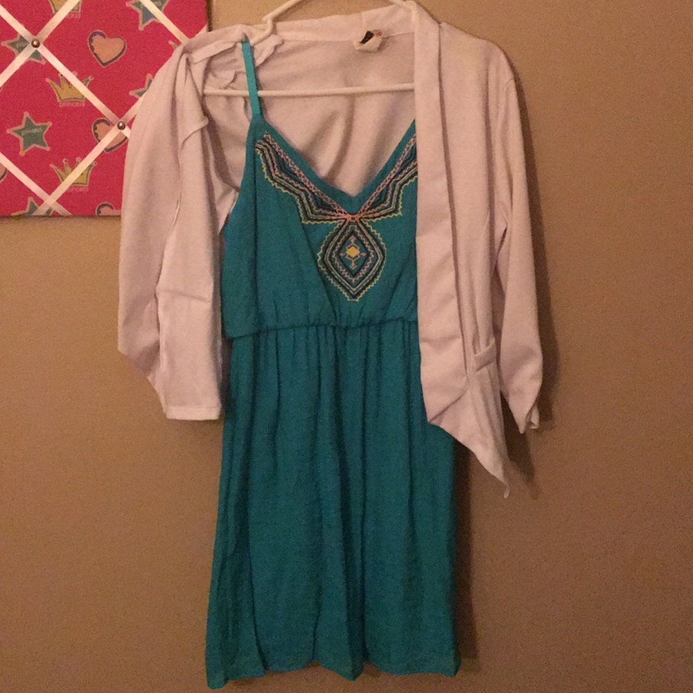Teal Maurice's dress and over coat