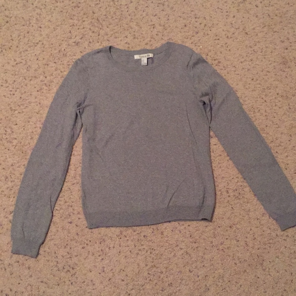 Grey sweater with brown corduroy elbow patches