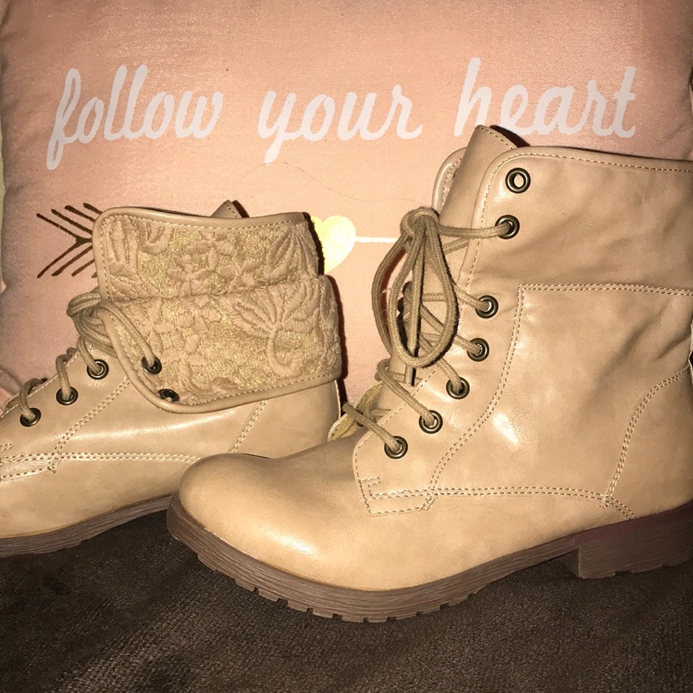 Tan lace up ankle height boots