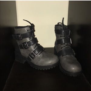 Gray and black combat boots