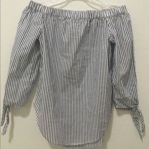 womans blue and white striped off the shoulder top