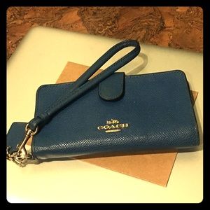Blue Coach snap wristlet with gold accents