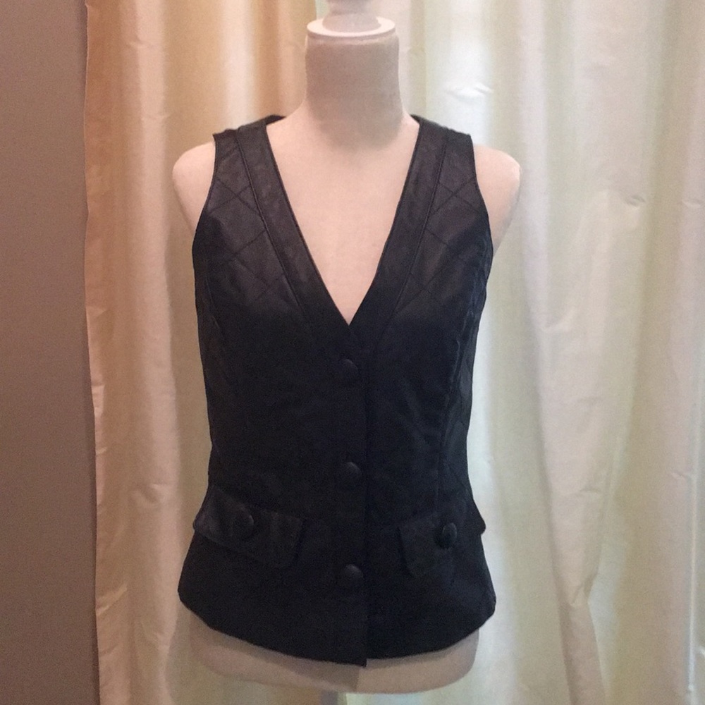 Black leather vest.