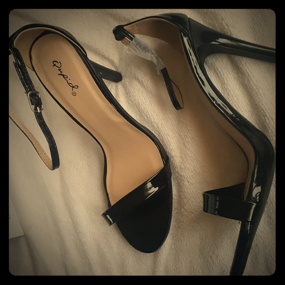 Black strappy patent leather high heels