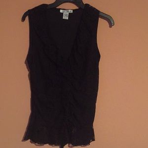 Black lace. V neck with ruffles.  Nylon spandex.
