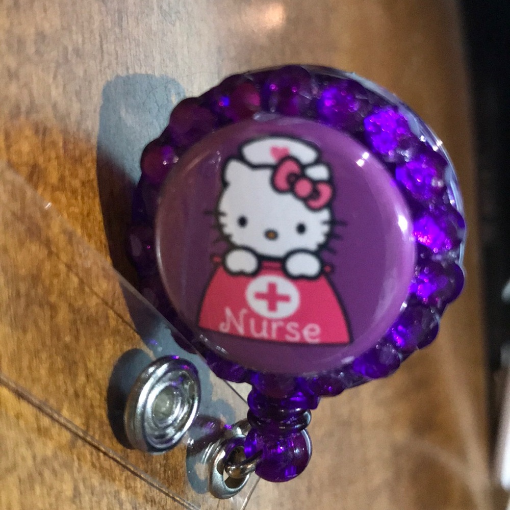 3/$35 Purple Hello Kitty  Nurse badge reel