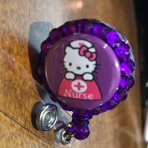 3/$35 Purple Hello Kitty  Nurse badge reel