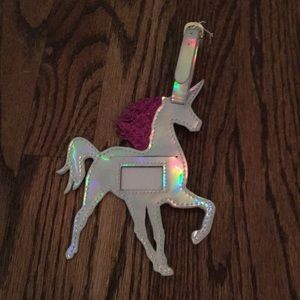 Holographic unicorn luggage tag.