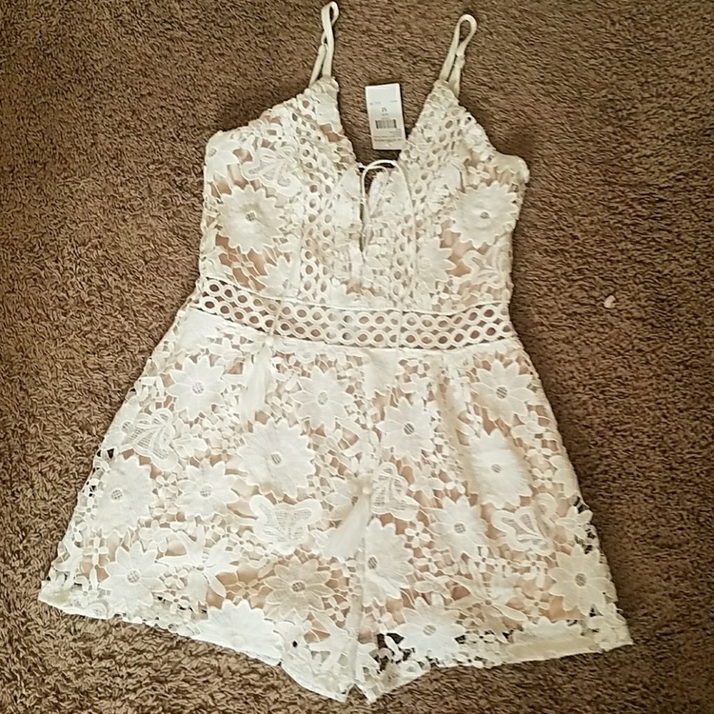 White embroidered romper with tan underlay