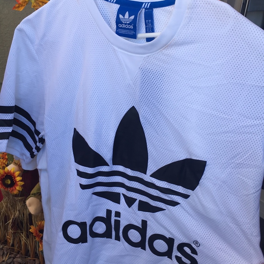 Brand new Adidas Jersey. Make up stain on collar.