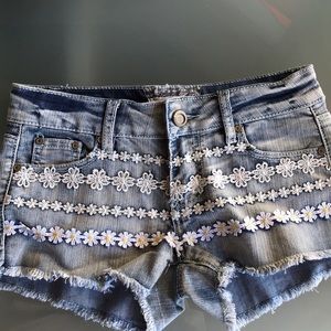 Jean shorts with flower print on front
