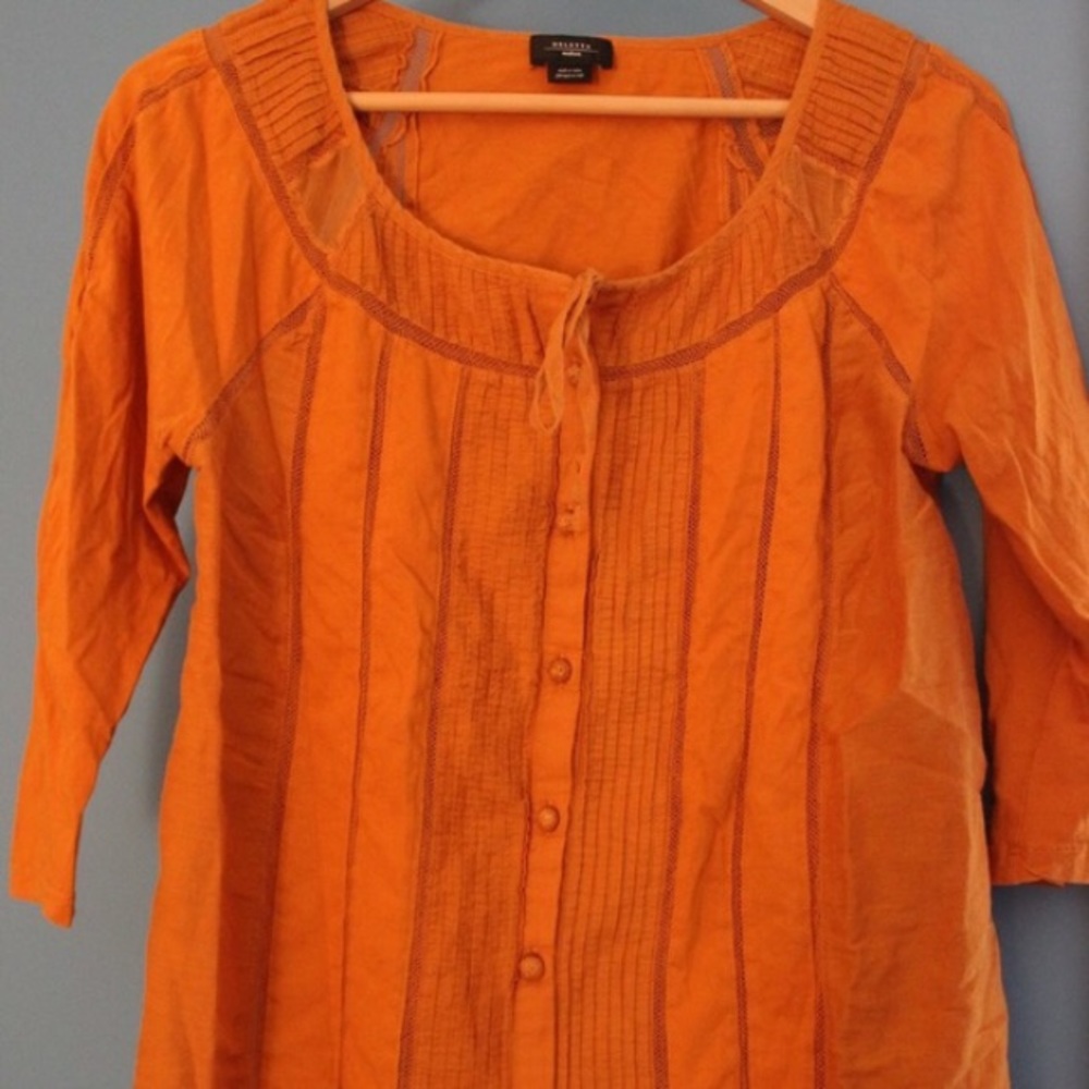 orange deletta button up top