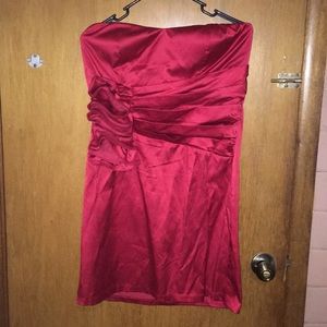 Short, red strapless dress.