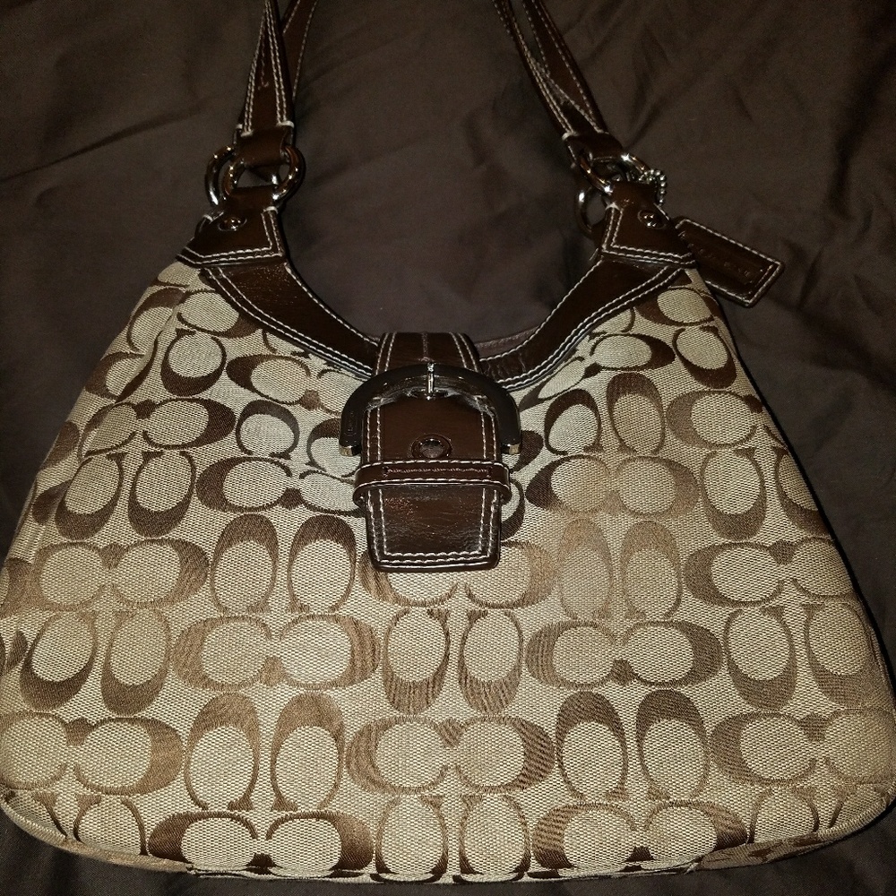 READ - Signature Coach bag - bag is M.I.A.