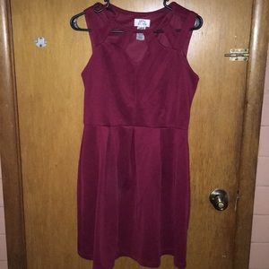 Short, bouncy burgundy dress with decorative front