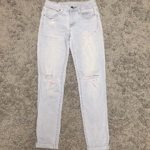 Ripped light wash AE skinny jeans