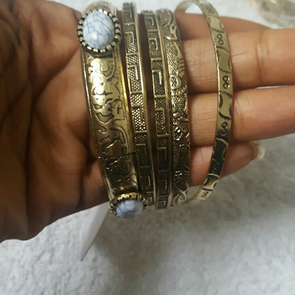 Gold plated bangles with a white design