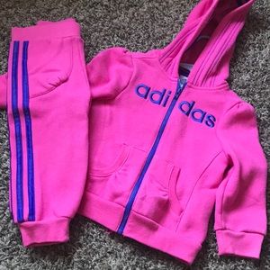 Pants and zip up sweater, pink in color