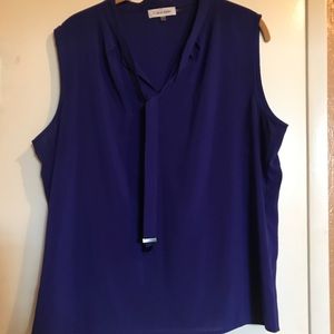 Sleeveless Calvin Klein blouse.