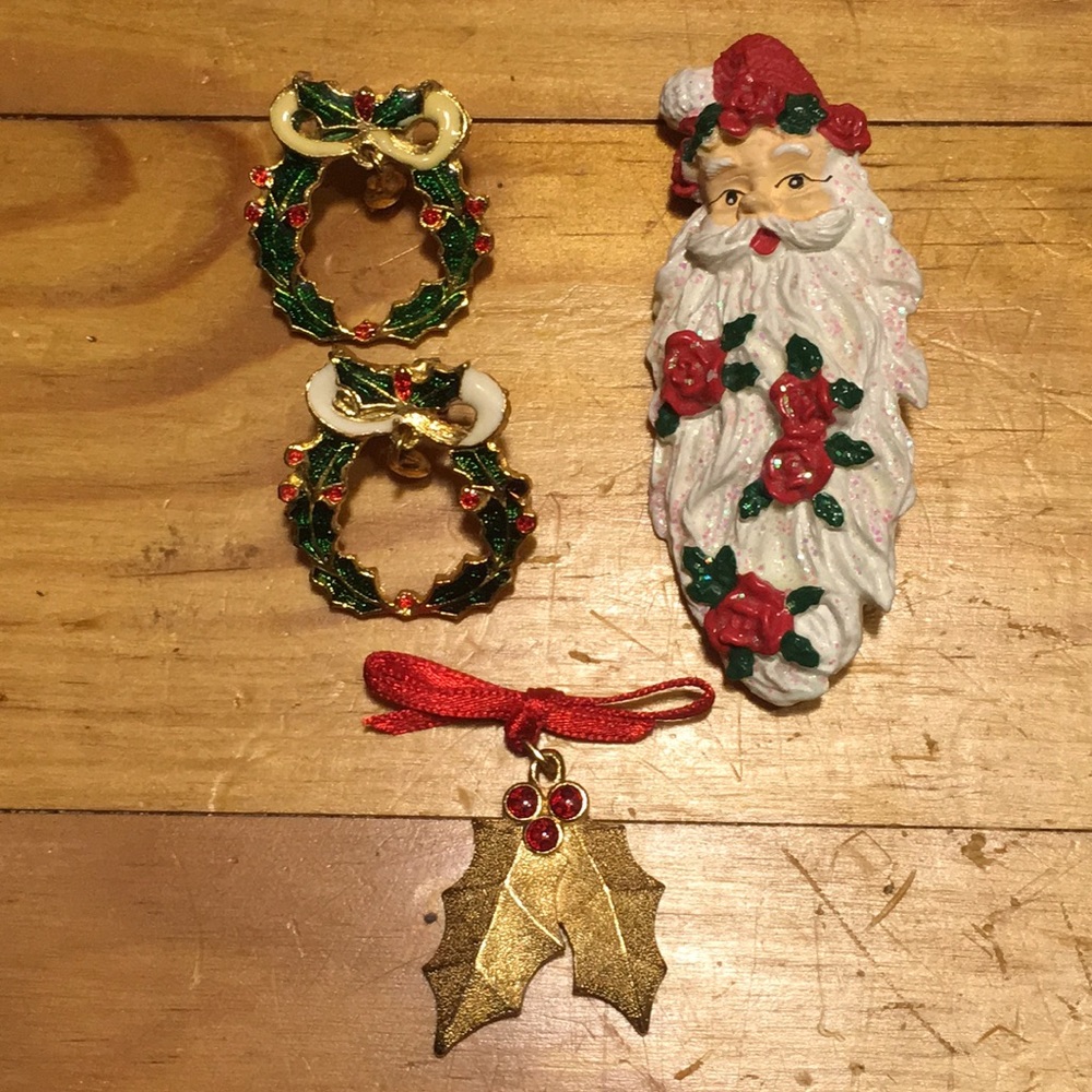 Three Christmas pins and a Christmas pendant