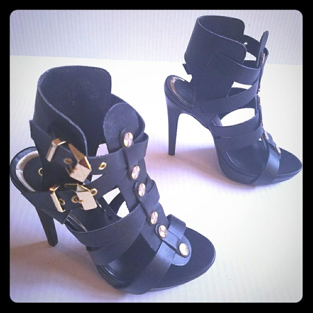 Black strappy heeled sandal with gold detail