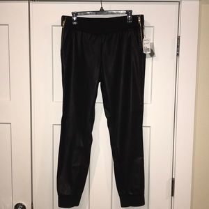 Faux leather jogger pant with gold zipper detail