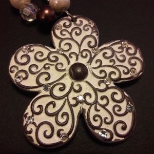 Brown and white pearl flower