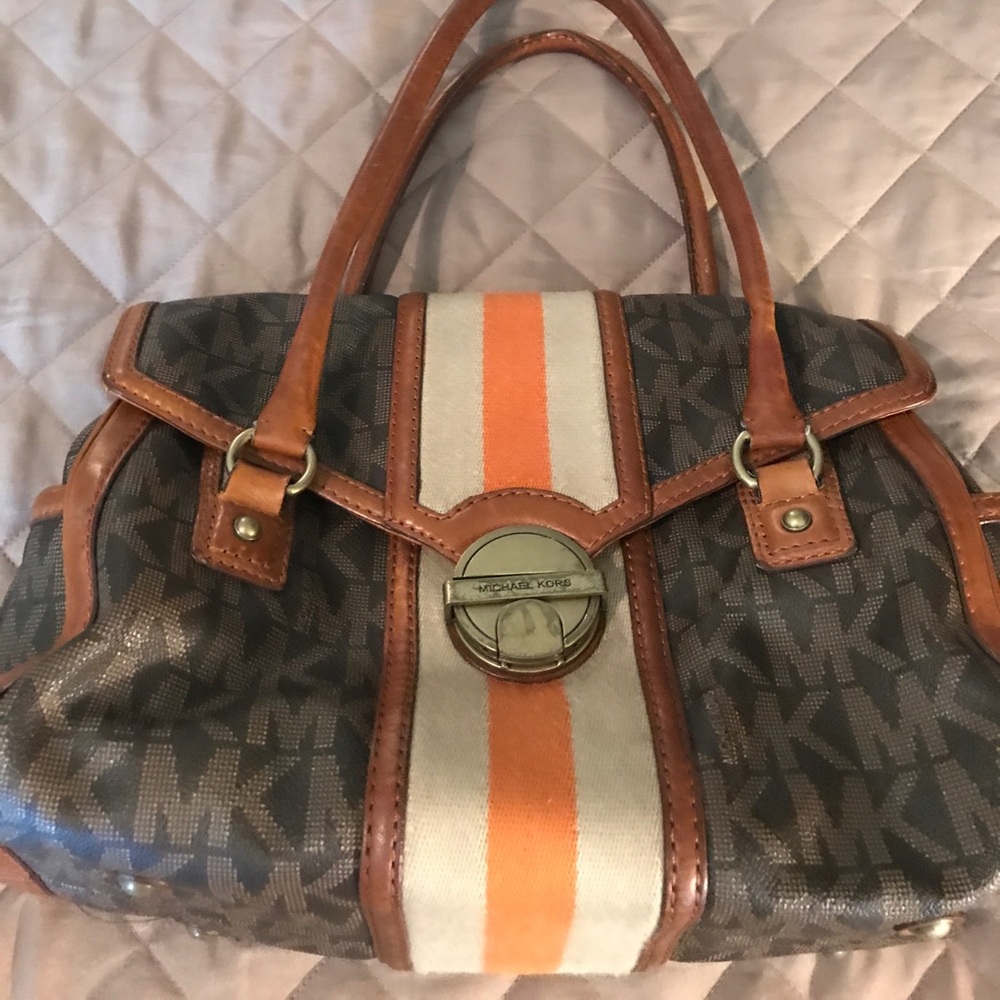 A used Pre owned Micheal Kors handbag.