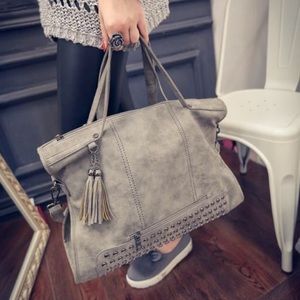 Gray studded handbag
