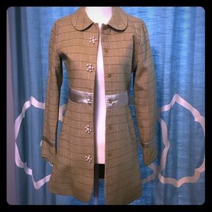 Green coat with pearl buttons